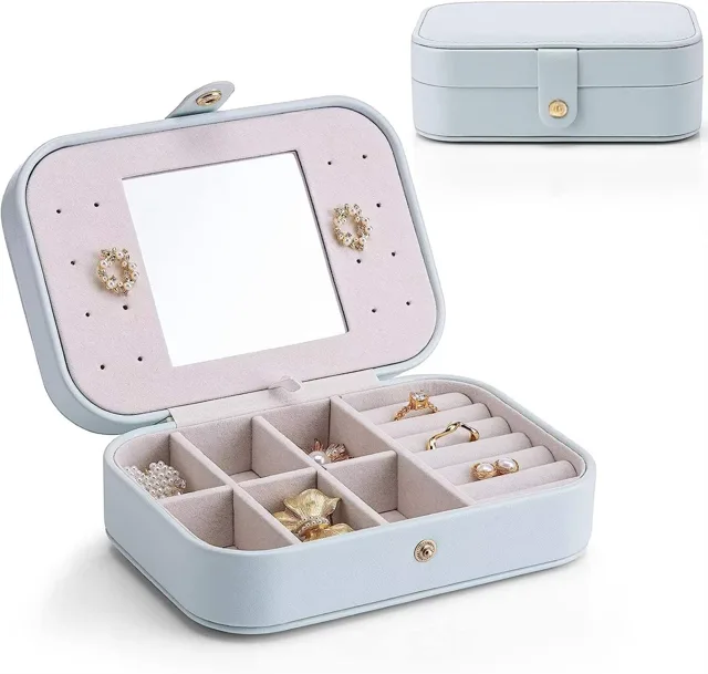 Pink travel jewelry box open with mirror and earring panel