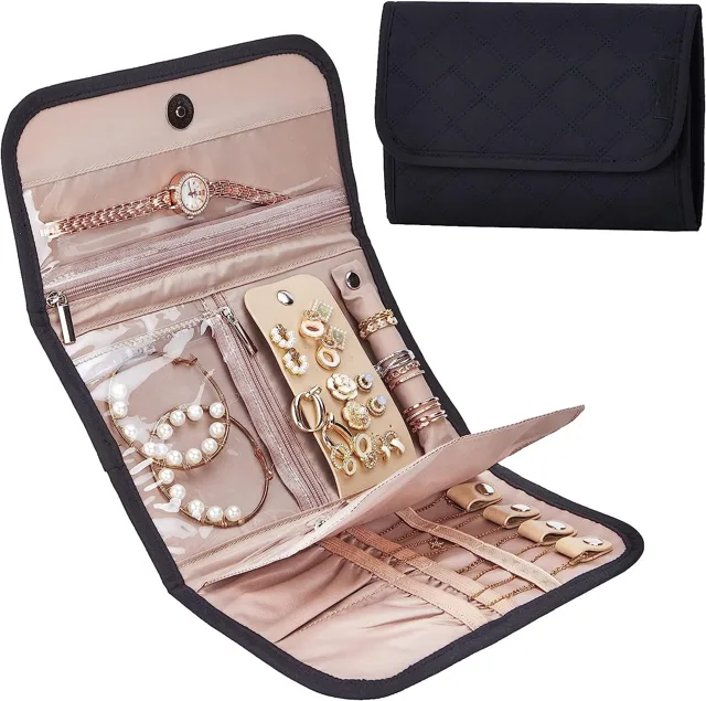 Black jewelry roll opened flat showing the earring panel