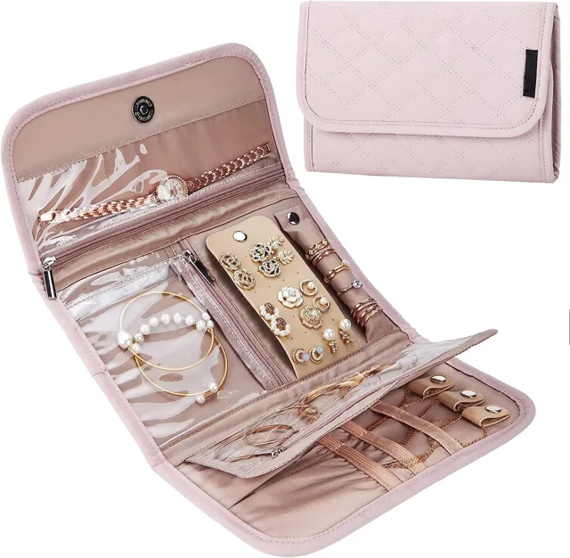 Pink jewelry organizer bag open showing straps and pockets