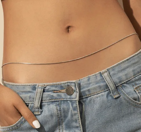 Gold belly chain close-up across the waist