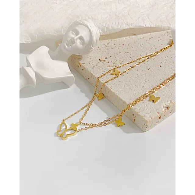 Butterfly anklet styled with a sculpture ornament
