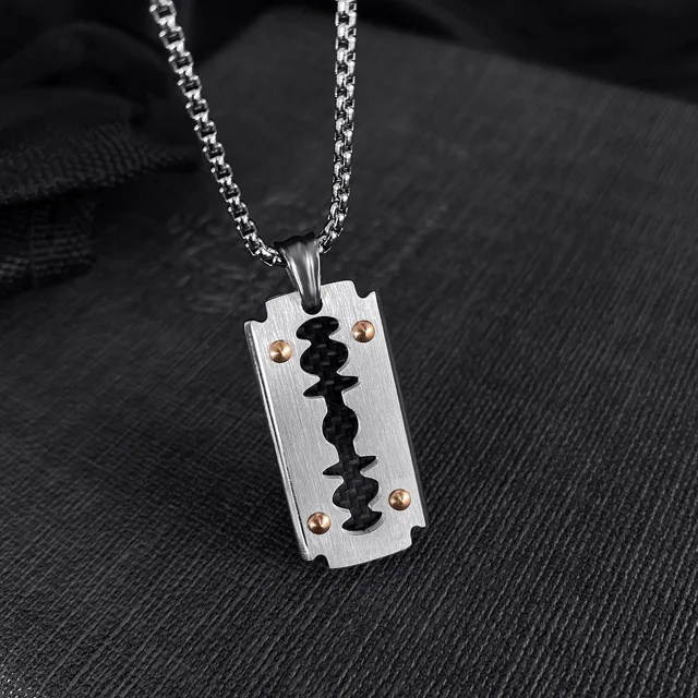 Blade pendant on grey fabric, second view