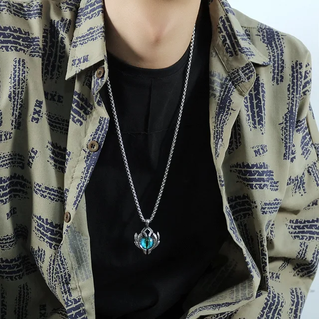 Model in a printed shirt wearing the pendant
