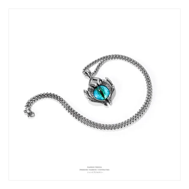 Evil eye necklace coiled on a white background