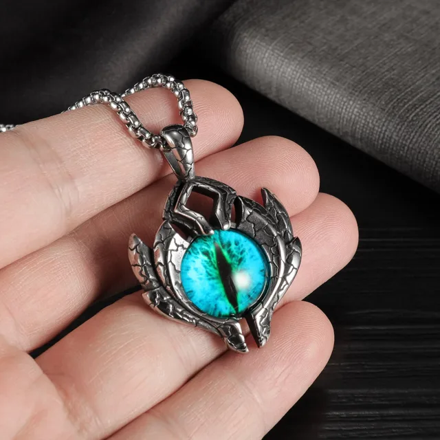 Open hand holding the evil eye pendant