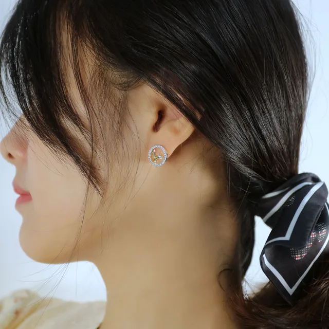 Model wearing the gold deer stud