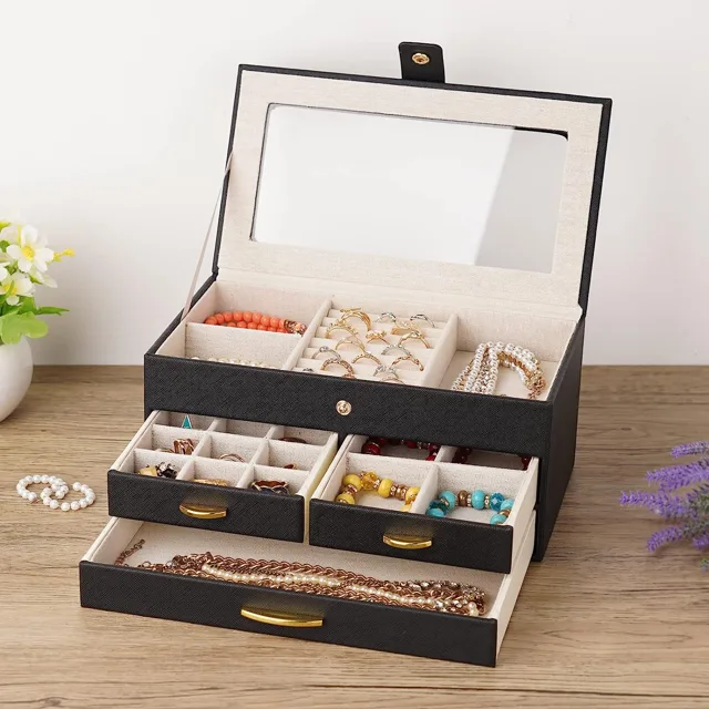 Cream jewelry box open with a mirror and jewelry trays
