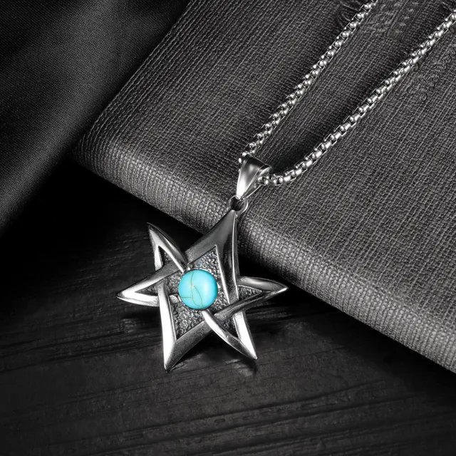 Star pendant on dark fabric, close view