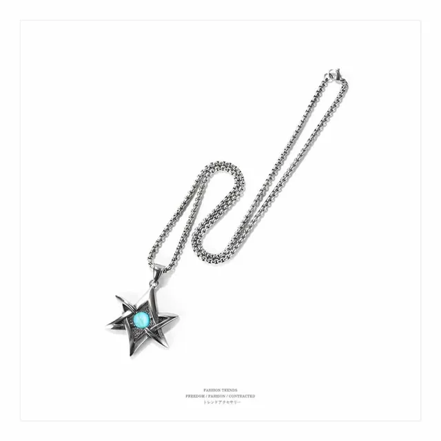 Star pendant necklace coiled on a white background