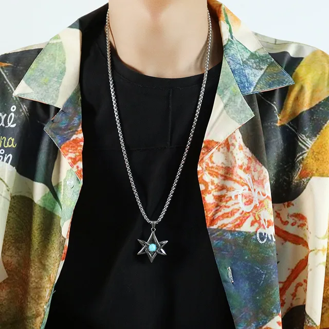 Model in a printed shirt wearing the star pendant