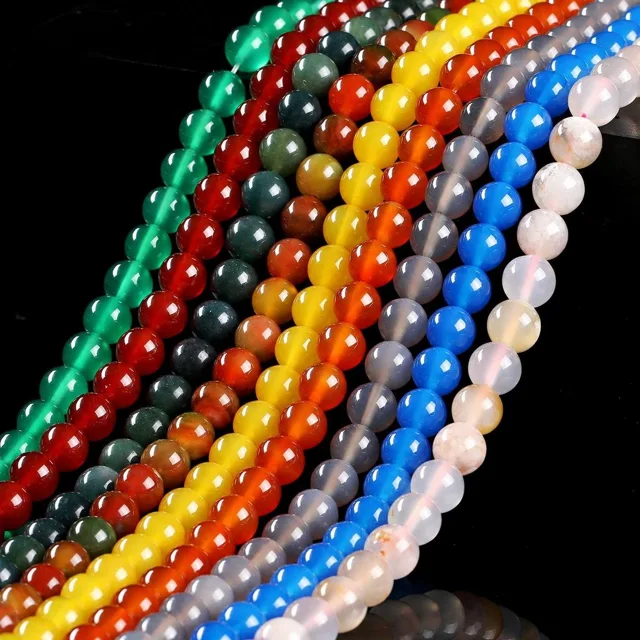 Agate bead strands in saturated colours laid in diagonal rows, bracelet components