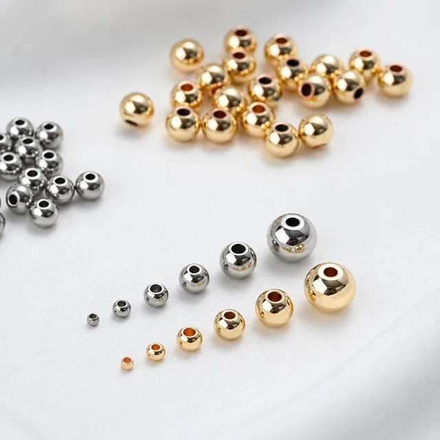 316L stainless steel beads in raw silver and PVD gold finishes for beaded bracelet production