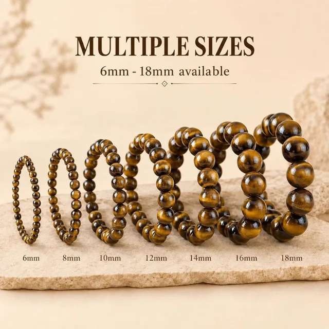 Tiger's eye bead bracelets in a size run from 6mm to 18mm displayed on a stone slab - OEM wholesale