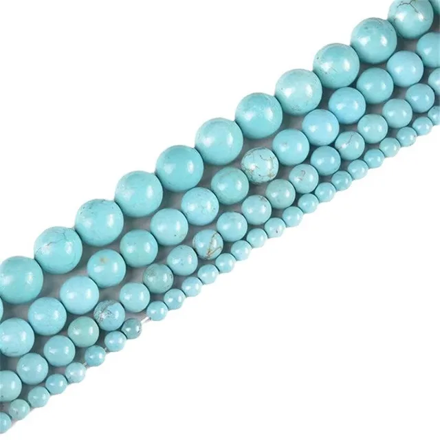 Graduated turquoise bead strands in light blue with natural veining, round beads for bracelet production