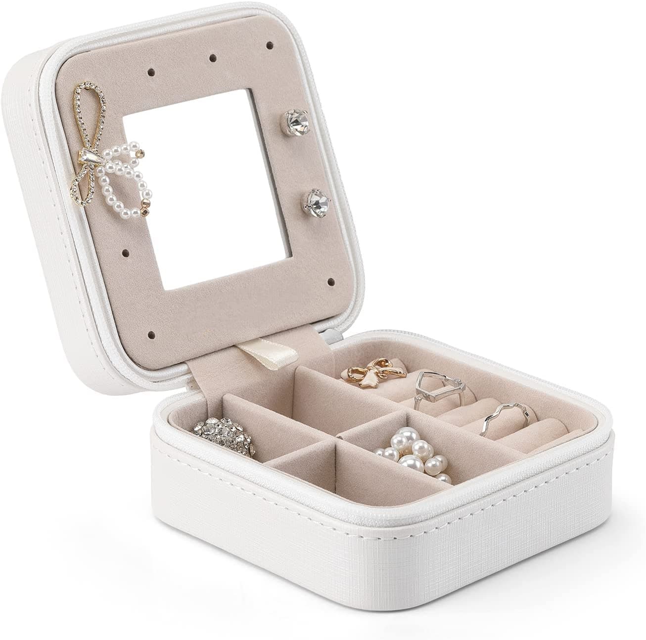 White square jewelry case open showing the mirror and ring rows