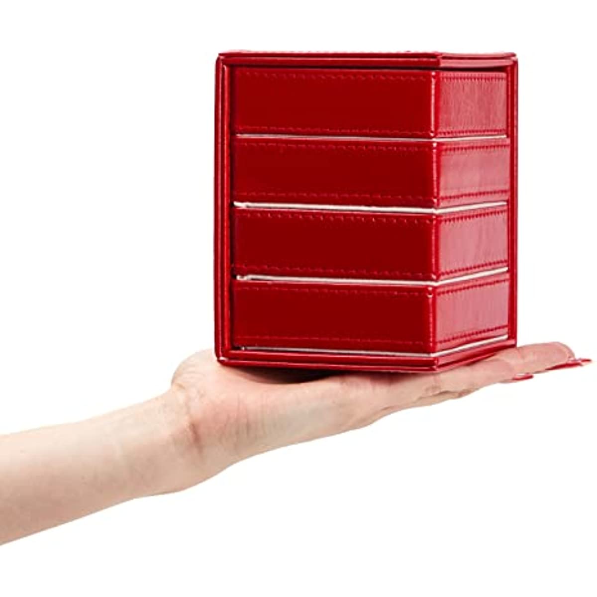 Red four-drawer jewelry tower held in an open palm