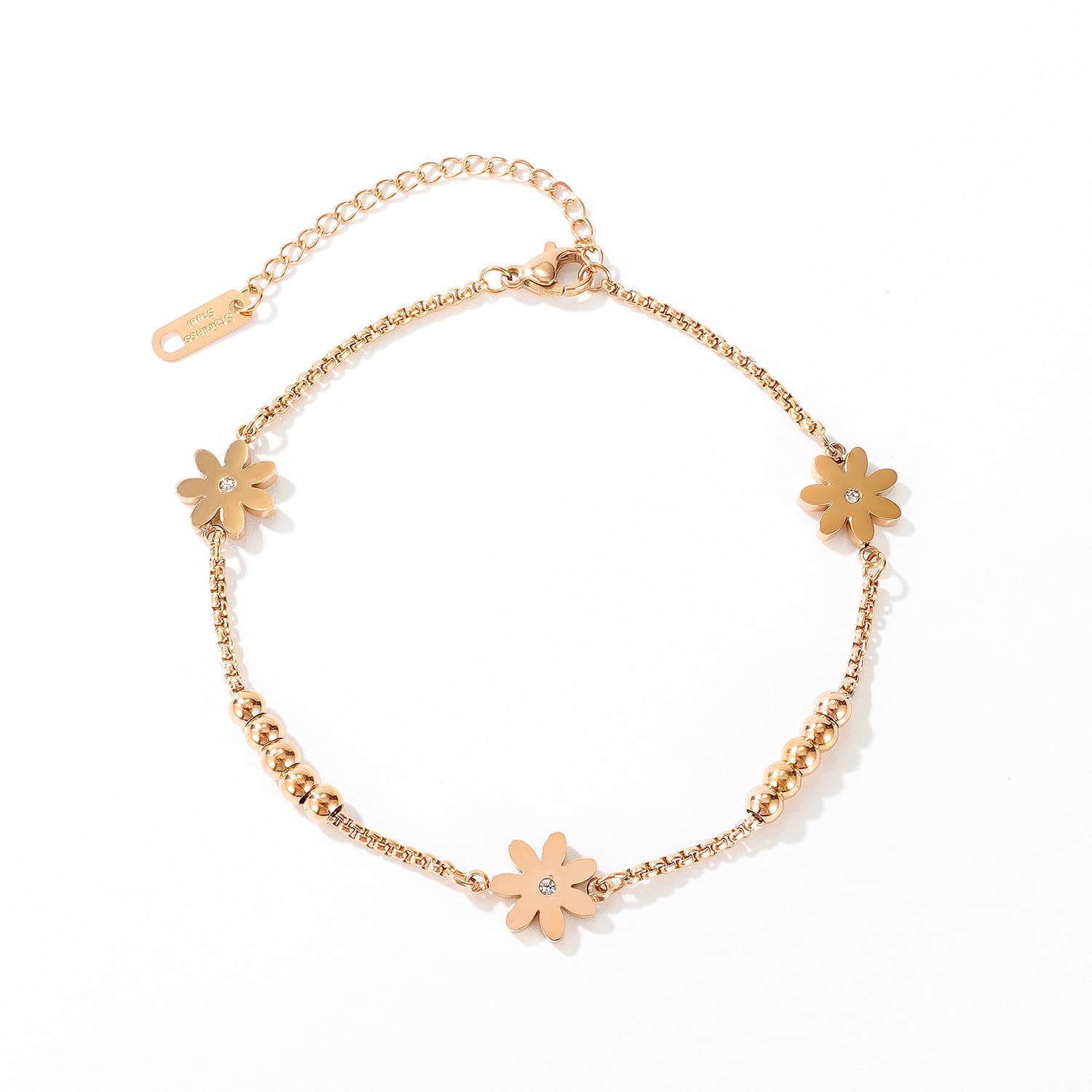 Rose gold flower anklet with zircon centres, flat lay