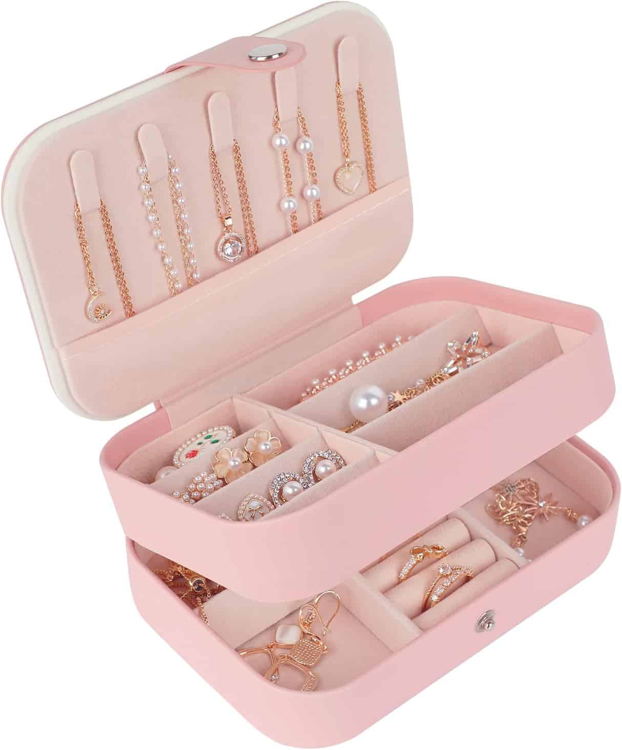 Blush pink two-tier mini case open with a stud panel