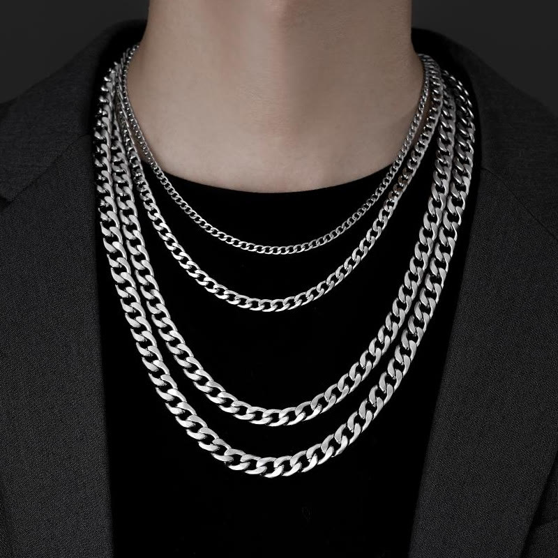 Men's silver Cuban link chains worn layered