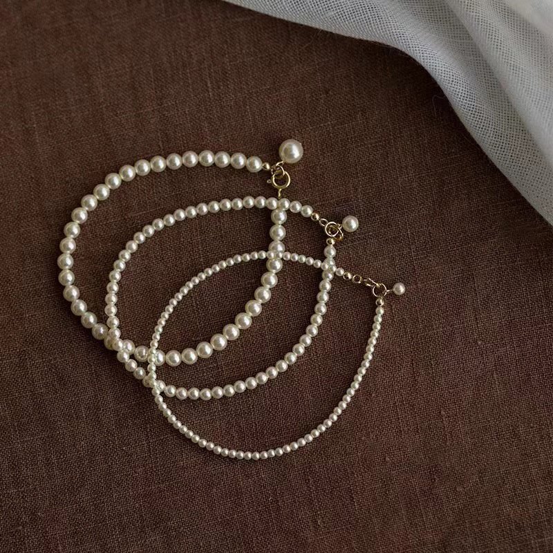 Three white freshwater pearl bracelets with gold-tone clasps in small, medium and large bead sizes - OEM wholesale