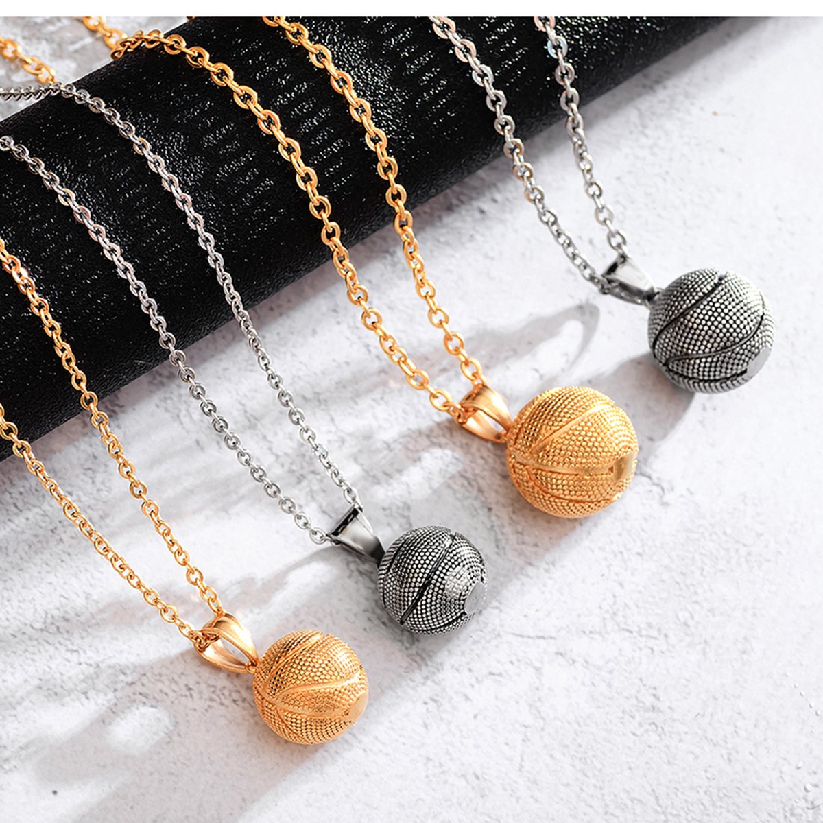 Stainless steel basketball pendant necklaces in gold, silver and black PVD finishes